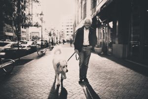 man walking dog leash