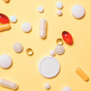 Pills And Tablets On Yellow